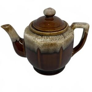 Vintage ceramic teapot with a brown and cream drip glaze finish.